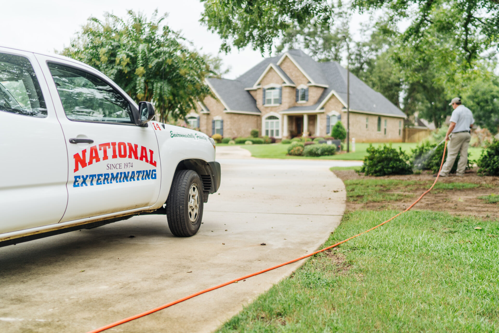 company trucked parked in the driveway of a suburban home